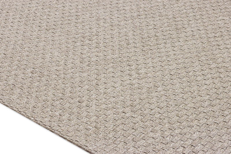 Beige woven area rug close-up with tight square texture