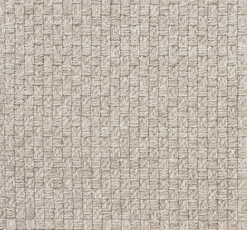 Beige woven area rug texture close-up with crisscross pattern