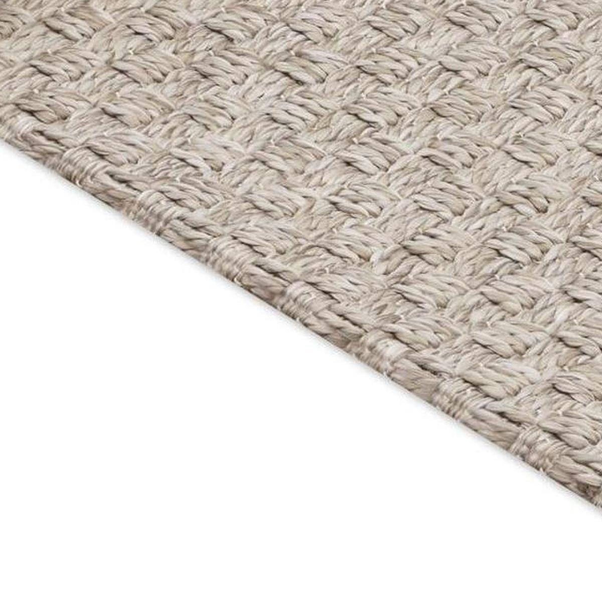 Beige woven area rug with low-profile surface and diagonal weave detail