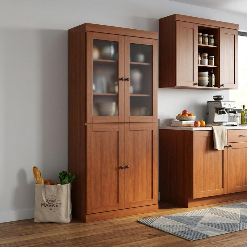Solid wood pantry cabinet with glass upper doors and two lower panel doors