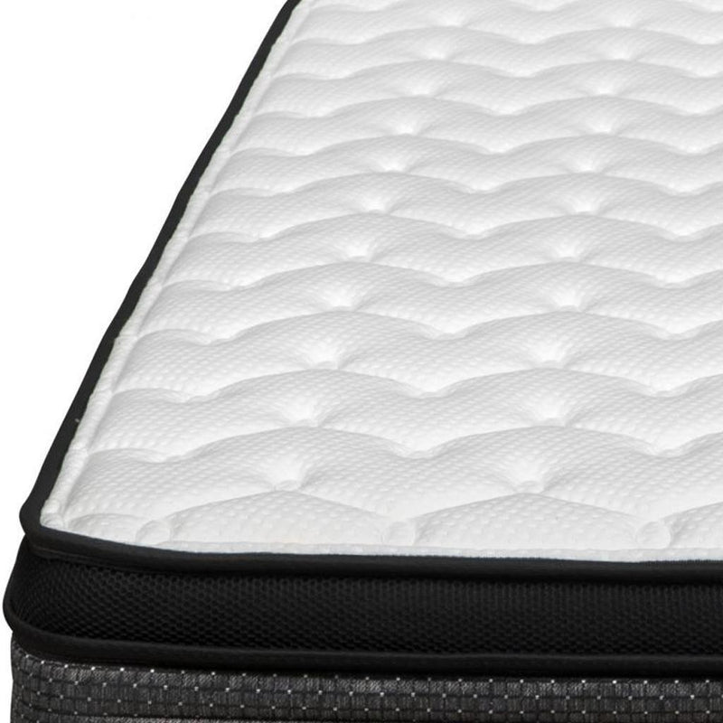 Medium euro top foam mattress close-up, white quilted surface with black side trim