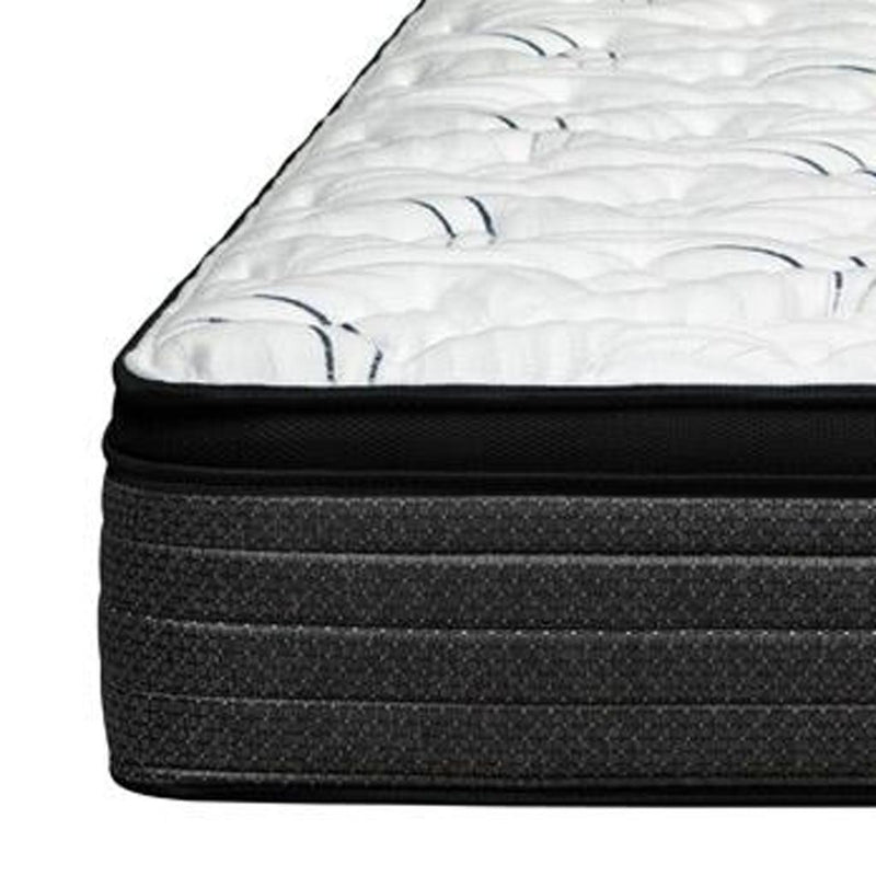 Euro-top mattress corner with white plush quilting and dark side panel
