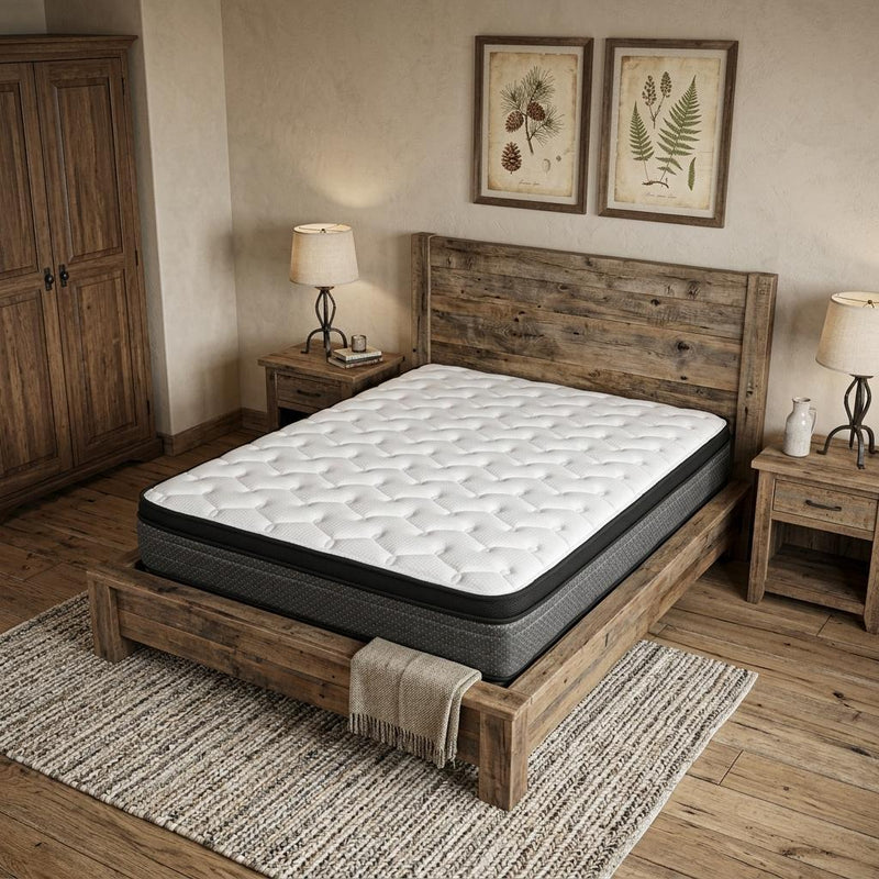 Foam mattress with white quilted surface and dark charcoal border on bed frame