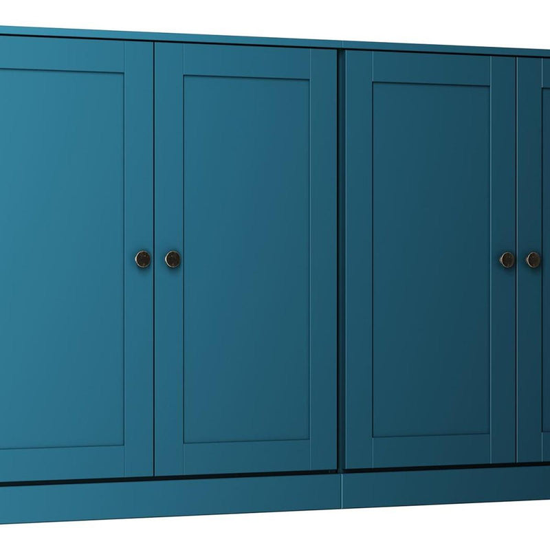Teal blue sideboard cabinet with paneled four-door fronts and round metal knobs