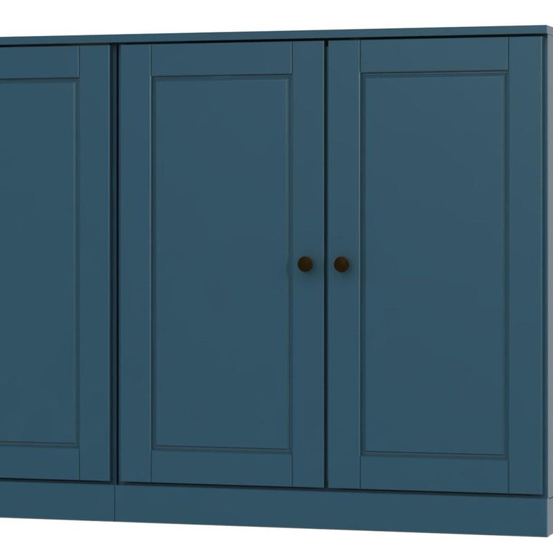 Teal blue wooden sideboard close-up: two cabinet doors with round knobs