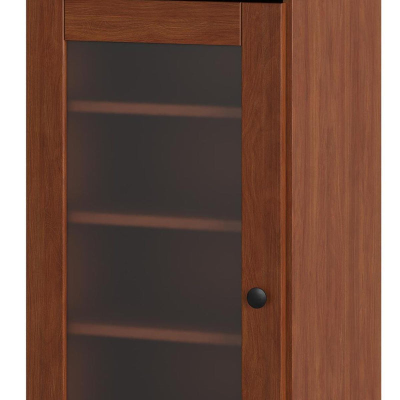 Close-up of frosted glass door and round knob on a wood shoe storage cabinet