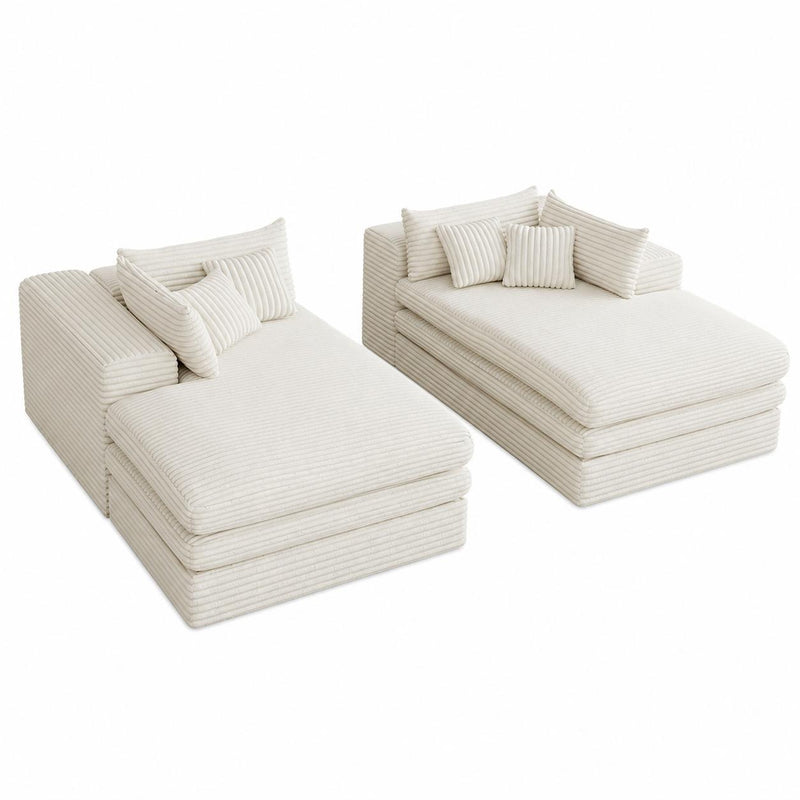 Set of two white corduroy chaise lounges with toss pillows, side-by-side view