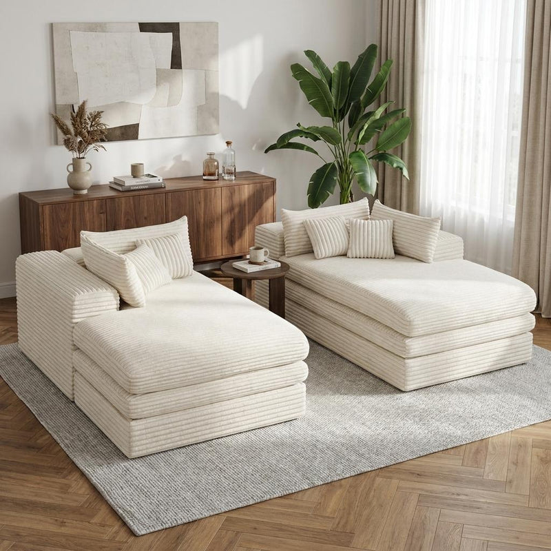 Two white corduroy chaise lounges with toss pillows, paired layout