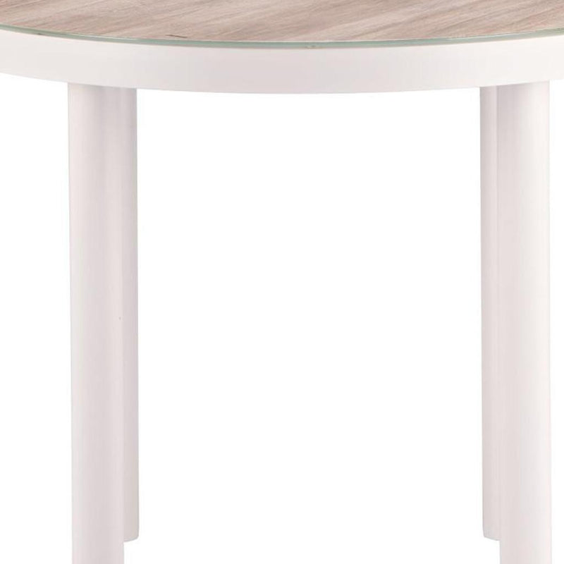 White aluminum table legs and underside of a round light wood tabletop