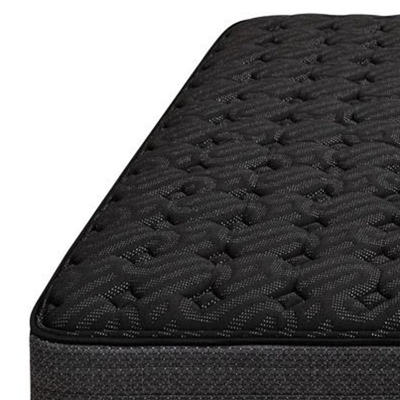 Black hybrid mattress top close-up with quilted pattern and textured surface