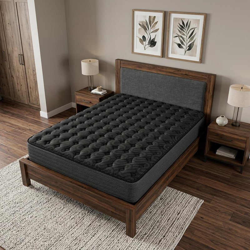 Black 13-inch hybrid mattress on wooden bed frame, quilted top visible