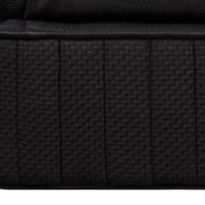 Black mattress side panel with vertical stitching and textured fabric, close-up