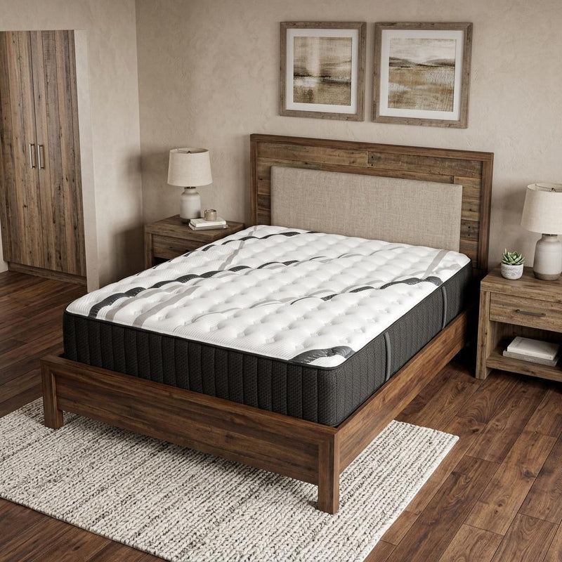 King hybrid mattress on bed frame: black sides and white quilted top with gray accents