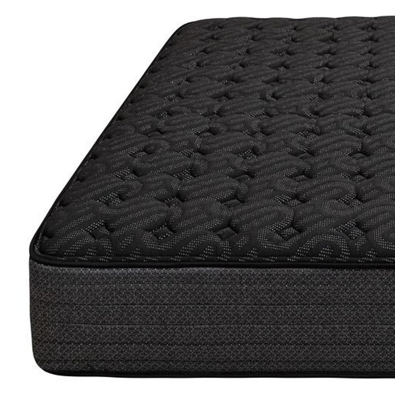 Dark black extra firm hybrid mattress with quilted top and fabric side panel.