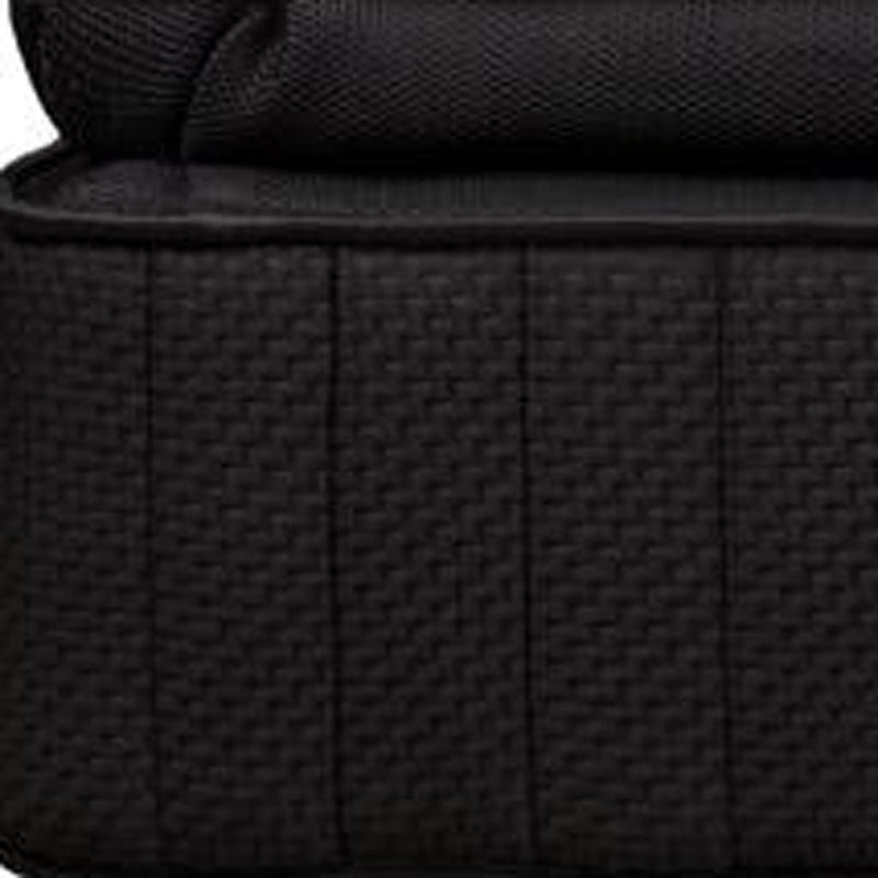 Close-up of black woven mattress side with vertical panel stitching