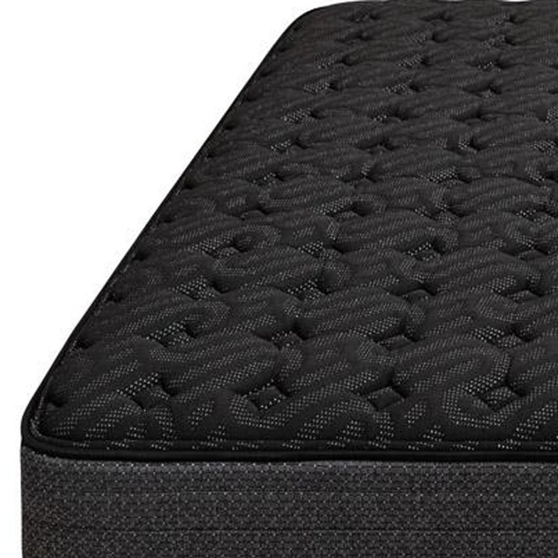 Black quilted mattress top with raised looped texture