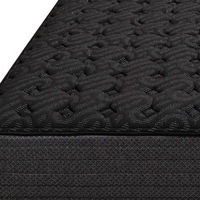 Black quilted gel memory foam mattress top with raised raised circular texture