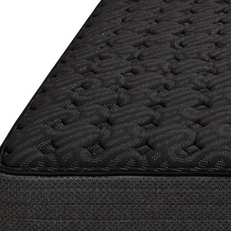 Close-up of dark gray quilted mattress top with raised tufted pattern