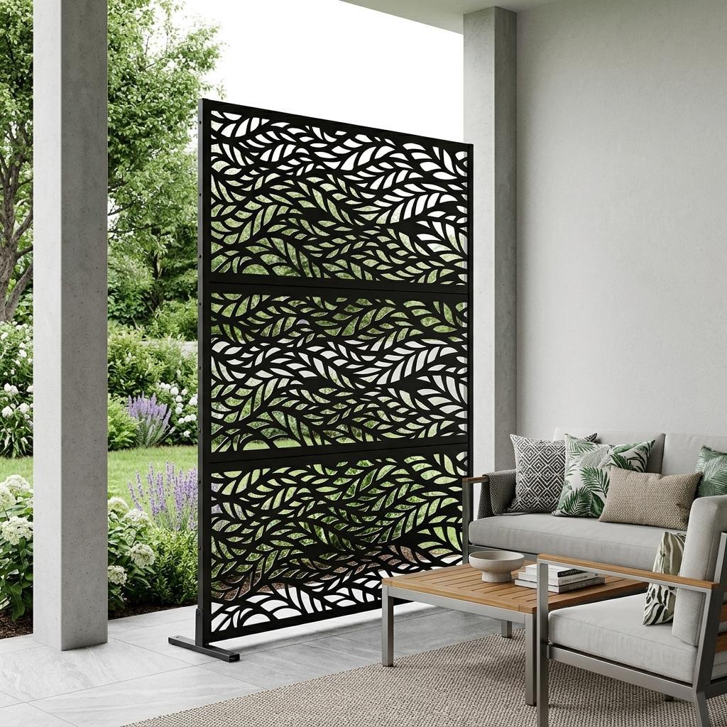 Outdoor privacy screen with black leaf cutout pattern and freestanding frame