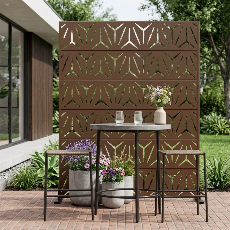 Brown steel outdoor privacy screen with geometric cutout pattern, patio display
