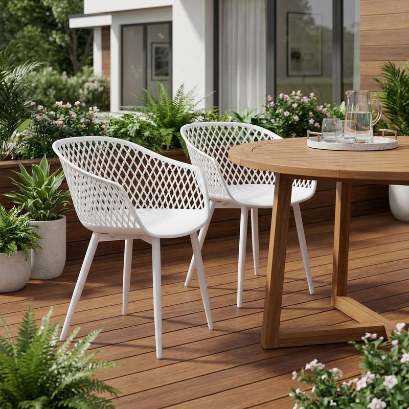 Two white plastic outdoor dining chairs with diamond lattice backs and curved seats