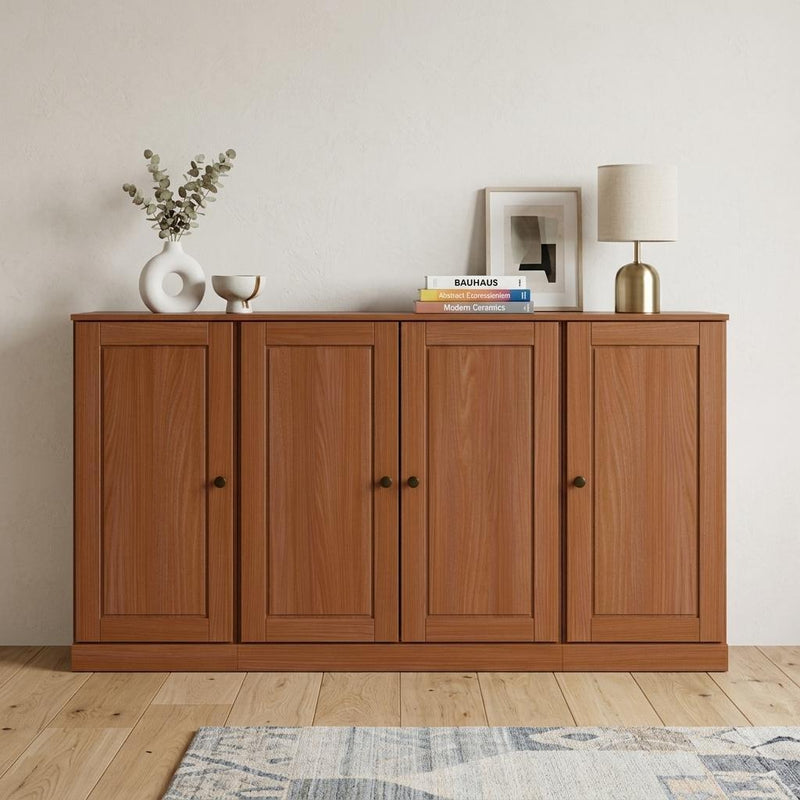 Brown sideboard with four paneled doors, dark knobs, and a low wide base