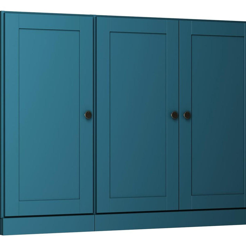 Teal blue sideboard door panels with round metal knobs, close-up