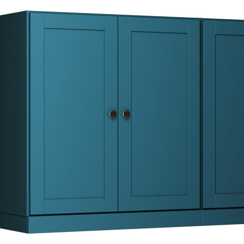 Teal blue wooden sideboard front with four doors and round brass-tone knobs
