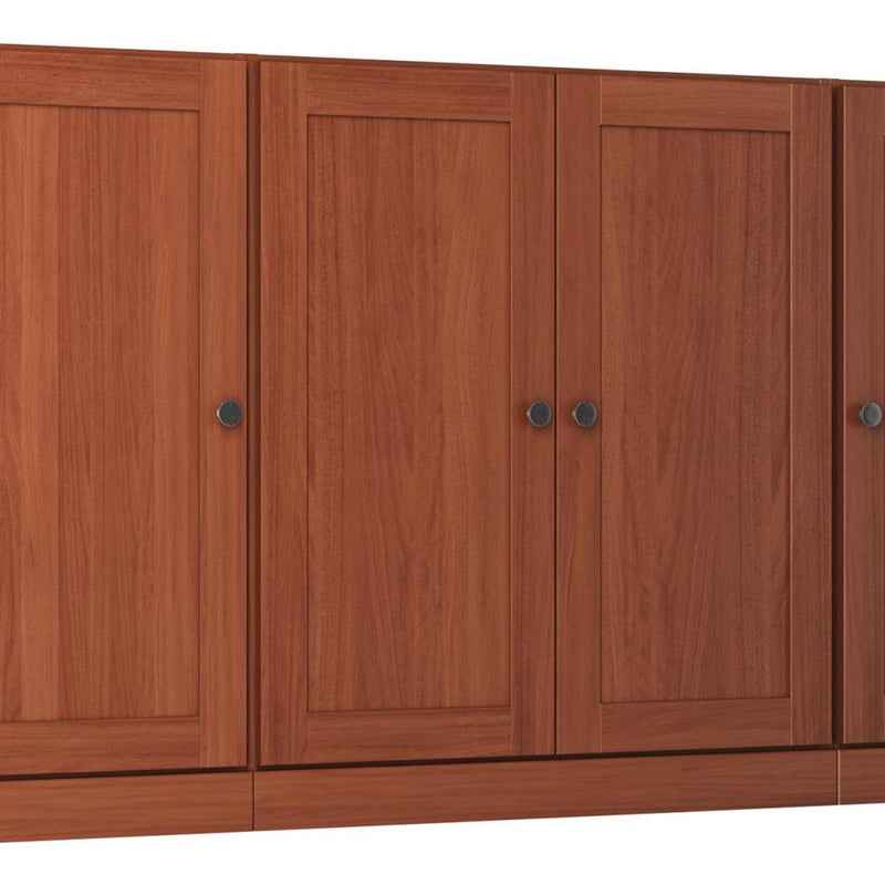 Brown solid wood sideboard with four paneled doors and round metal knobs