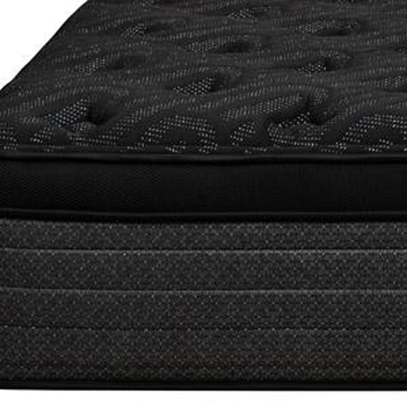 Close-up of dark plush euro top on hybrid mattress with quilted textured surface