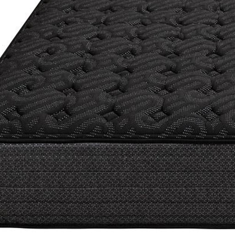 Black quilted mattress top close-up with textured gel-style pattern