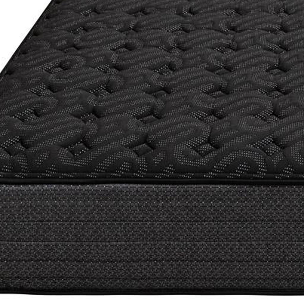 Black woven mattress with textured pattern and supportive foam base, ideal for contemporary bedroom decor.