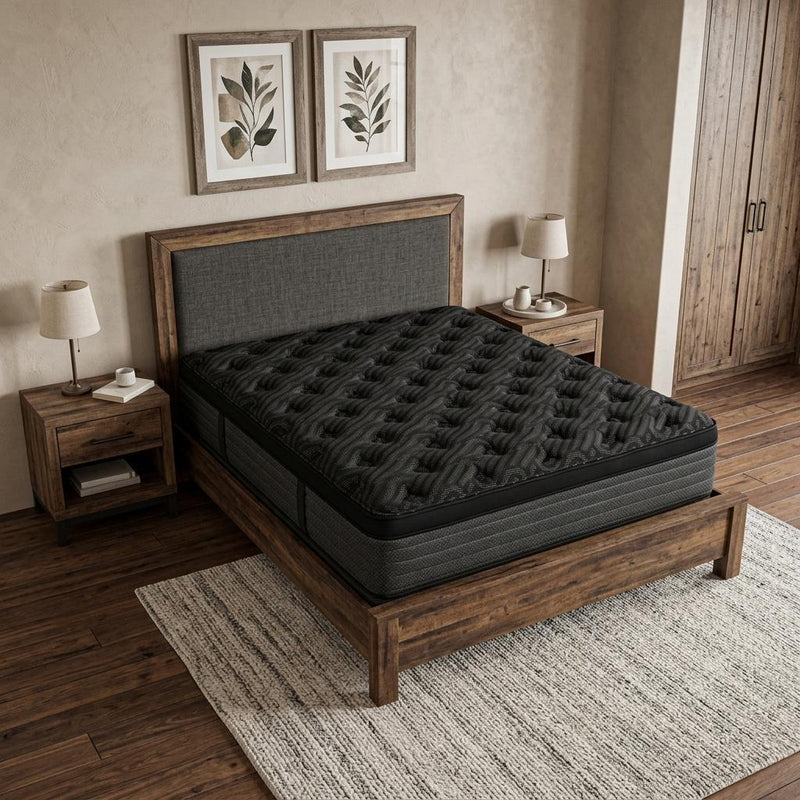 Black plush Euro top hybrid mattress on a dark wooden bed frame