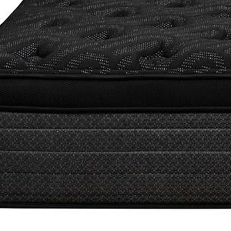 Black mattress side close-up with stitched border and layered foam cover