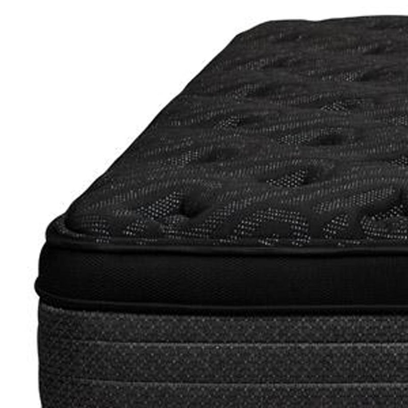 Close-up of black mattress quilting with padded foam edge