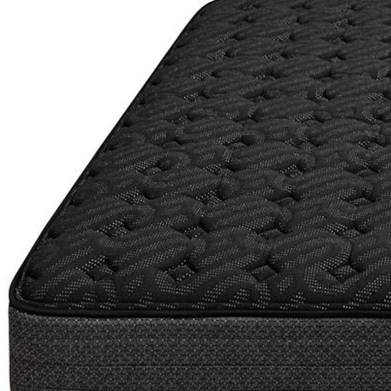 Black quilted mattress surface with raised web-like pattern