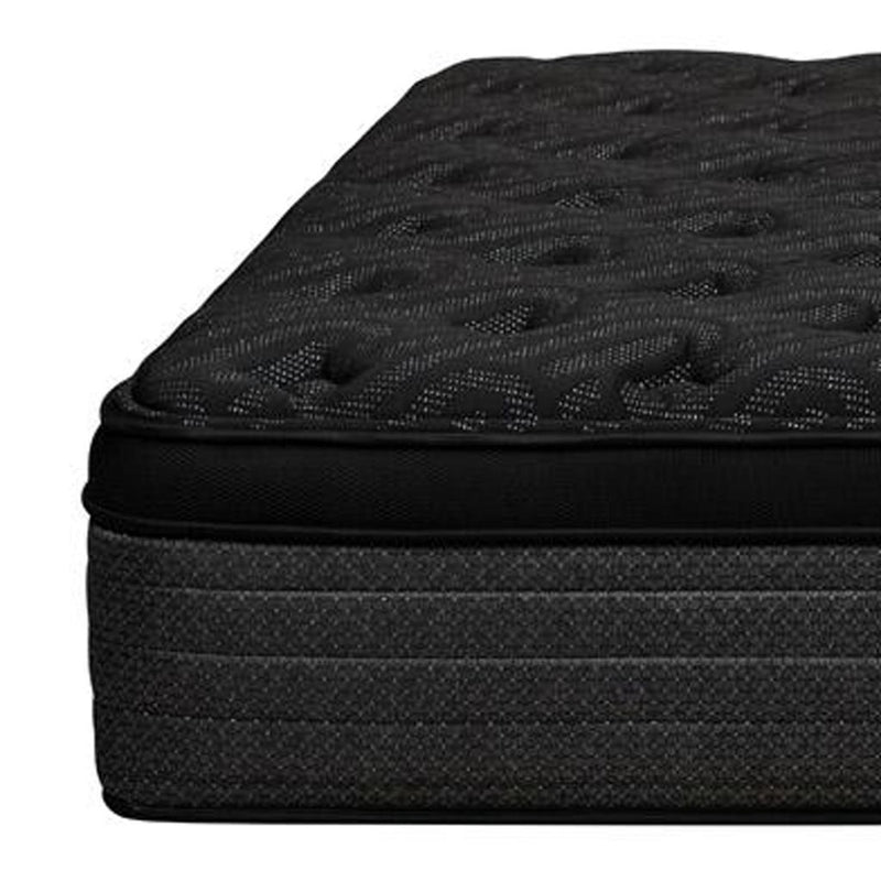 Corner of plush euro top hybrid mattress with dark textured fabric and black border