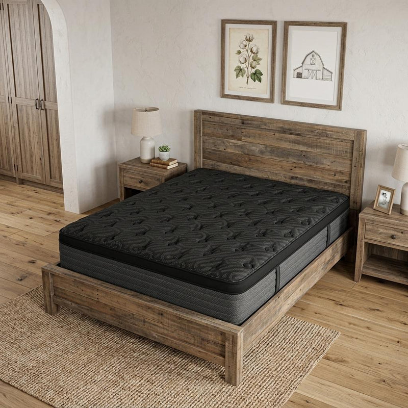 Black queen-size hybrid mattress on wooden bed frame, quilted plush top