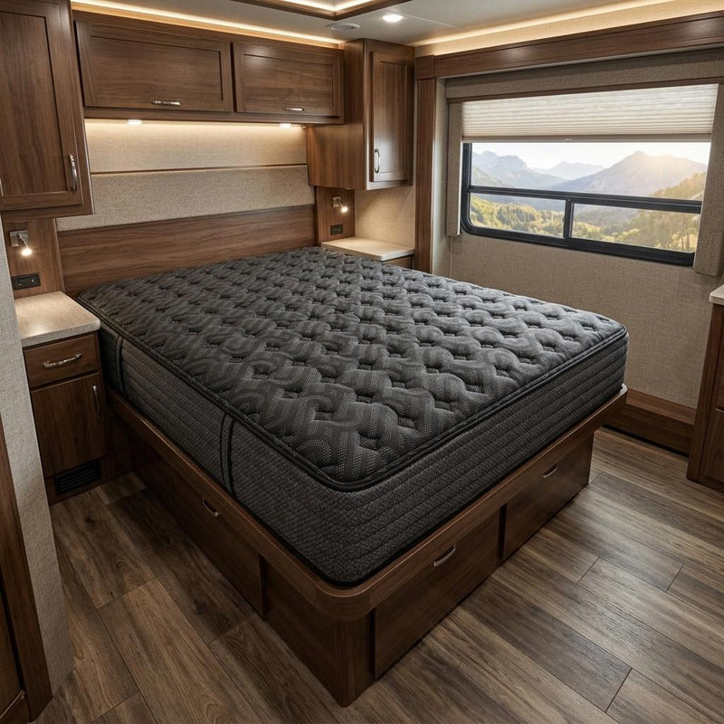 Black quilted hybrid mattress on a wooden bed frame
