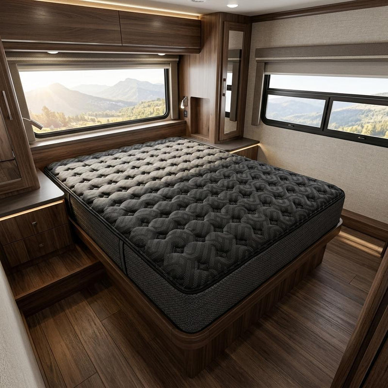 Black firm hybrid mattress on a bed frame with quilted tufted top