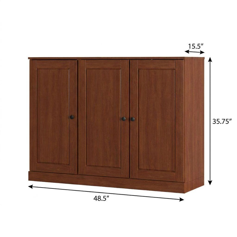 Brown solid wood shoe storage cabinet with three front doors and black knob pulls