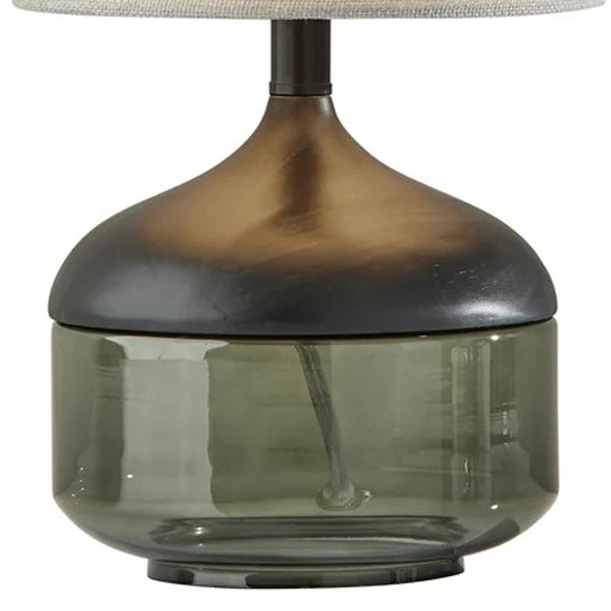 Bronze and green glass table lamp with a fabric shade, modern design perfect for contemporary interiors.