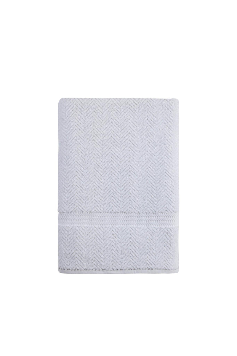White chevron bath sheet, folded with stitched border band.
