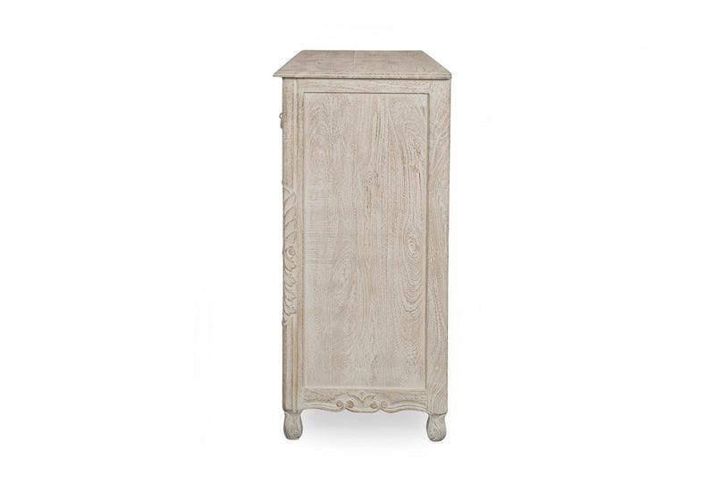 Whitewashed solid wood dresser with decorative side panels and four corner feet