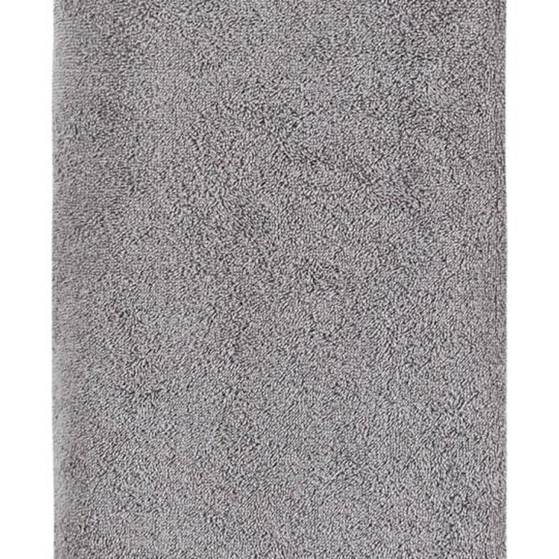 Light gray Turkish cotton bath towel end with looped terry texture close-up
