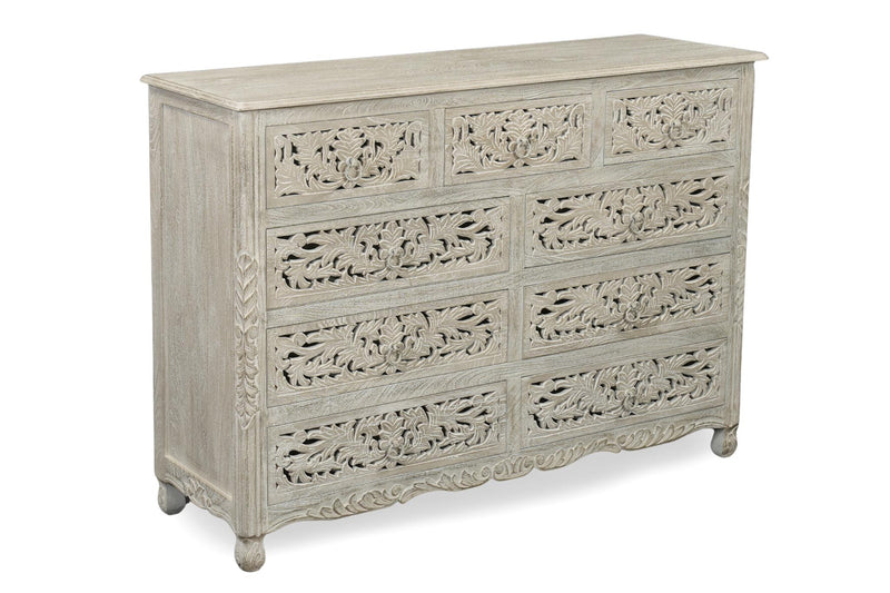 Gray carved wood nine-drawer dresser with ornate floral drawer fronts and rounded feet