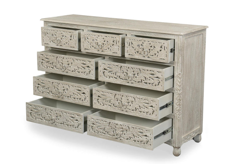 Gray carved wood nine-drawer dresser with floral front panels and metal drawer pulls