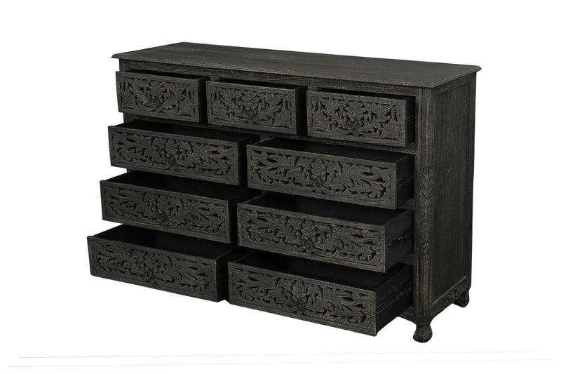 Black carved wooden dresser with nine drawers and ornate floral paneling