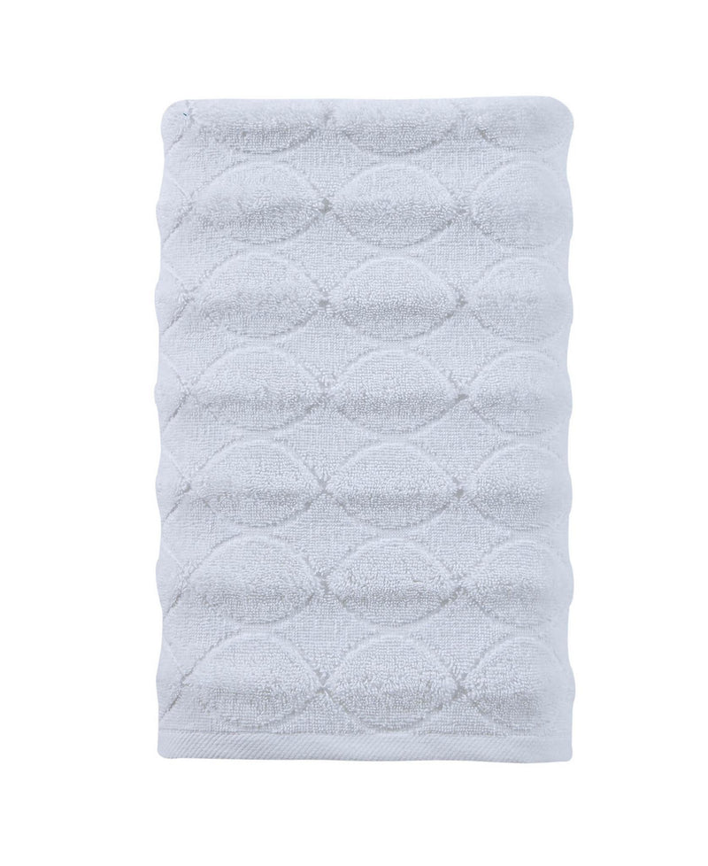 Folded white bath towel with jacquard diamond-and-circle embossed pattern