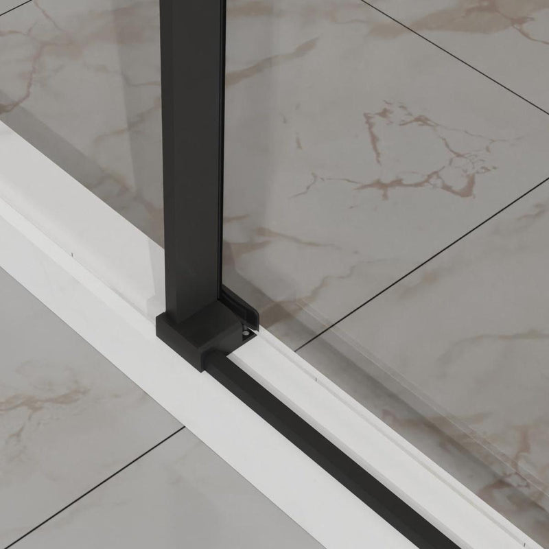 Tempered glass shower door panel with dark vertical frame and track